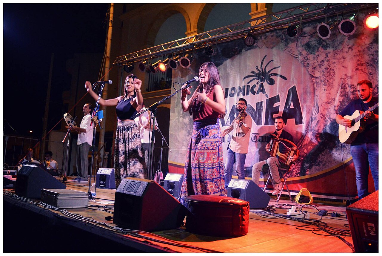 Musicians and dancers at a summer folk festival in Salento