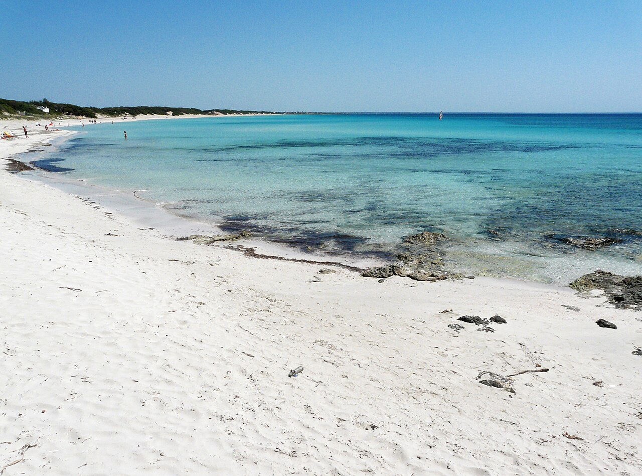 White sand and shallow turquoise water on the Ionian coast